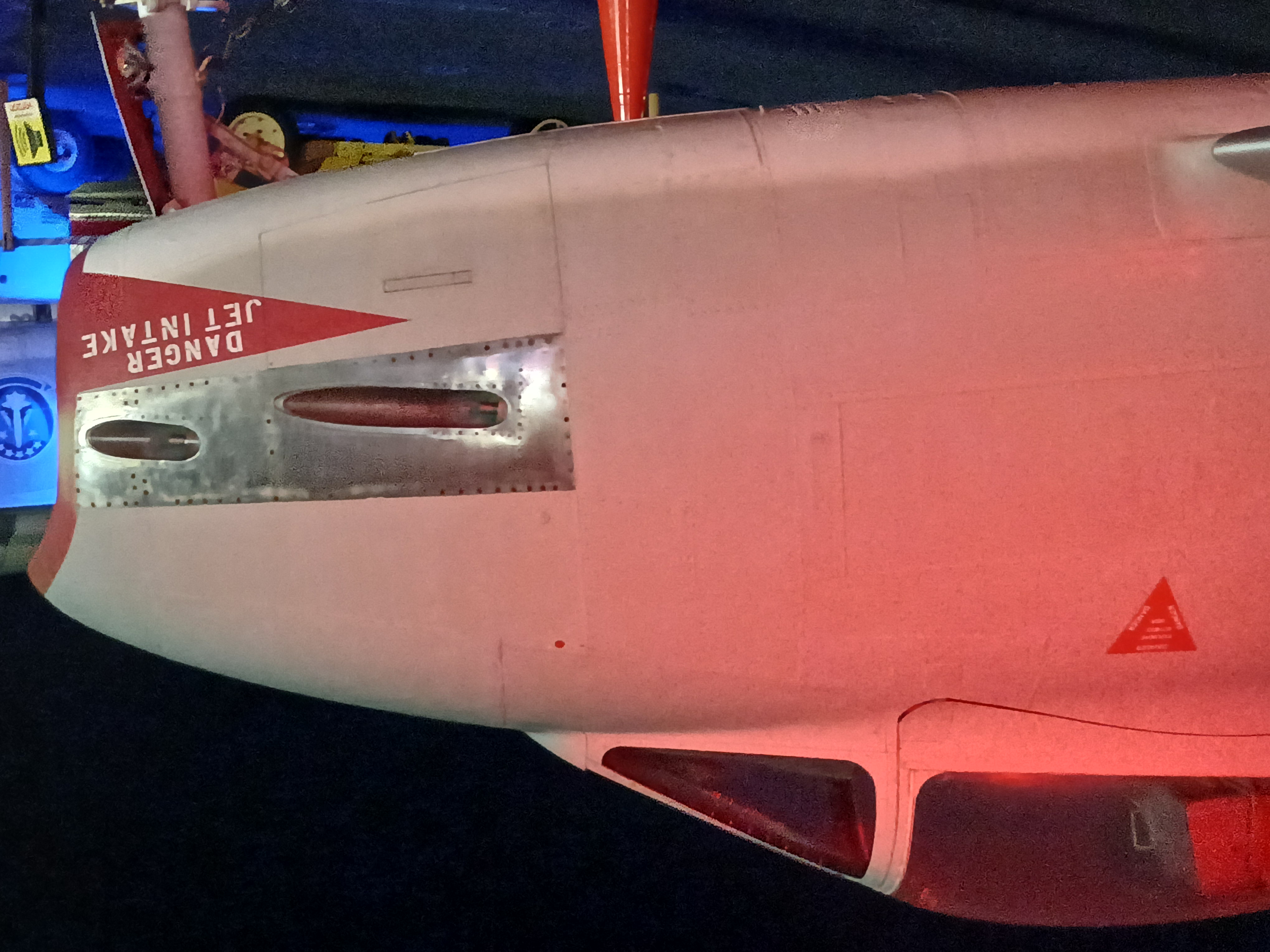 The cockpit and short nose of a jet plane whose nose is the air intake for an internal engine.