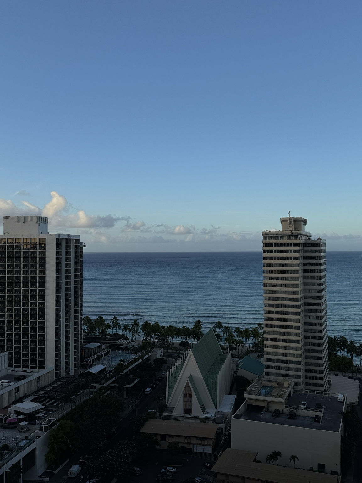 Skyline of Honolulu with mountains and clouds