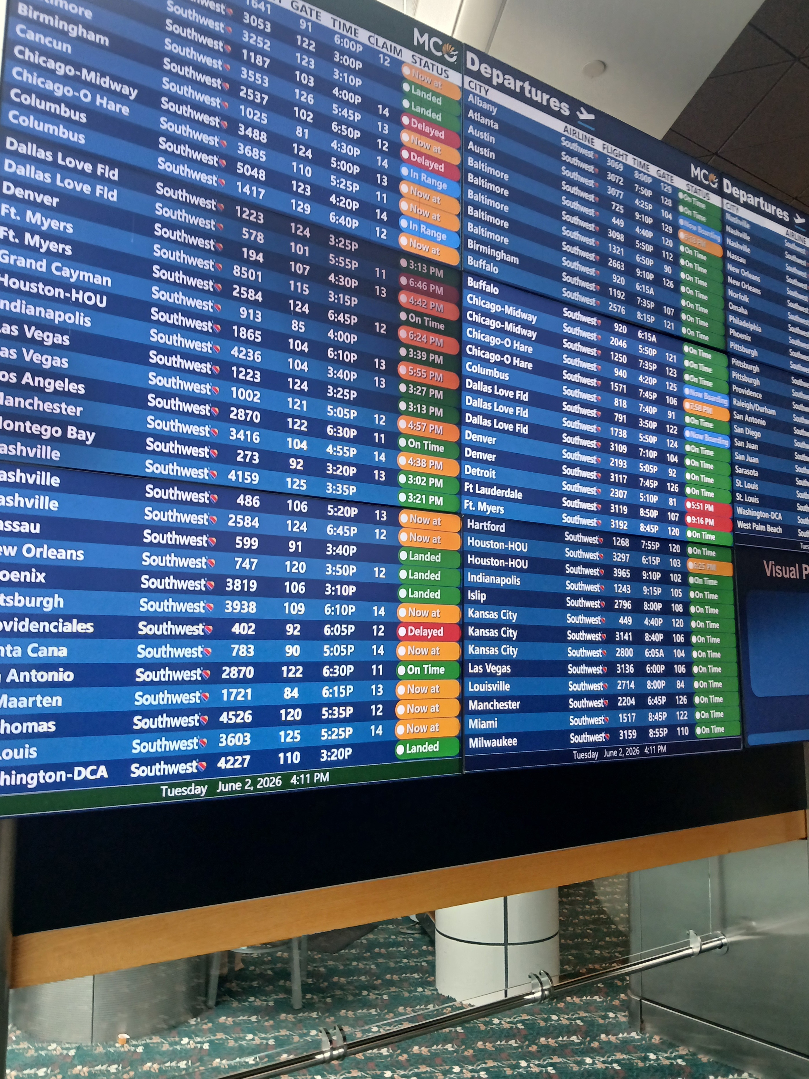 Flight board at MCO. My 6:45 PM flight to Denver stands just right of center about half way down the list of departures