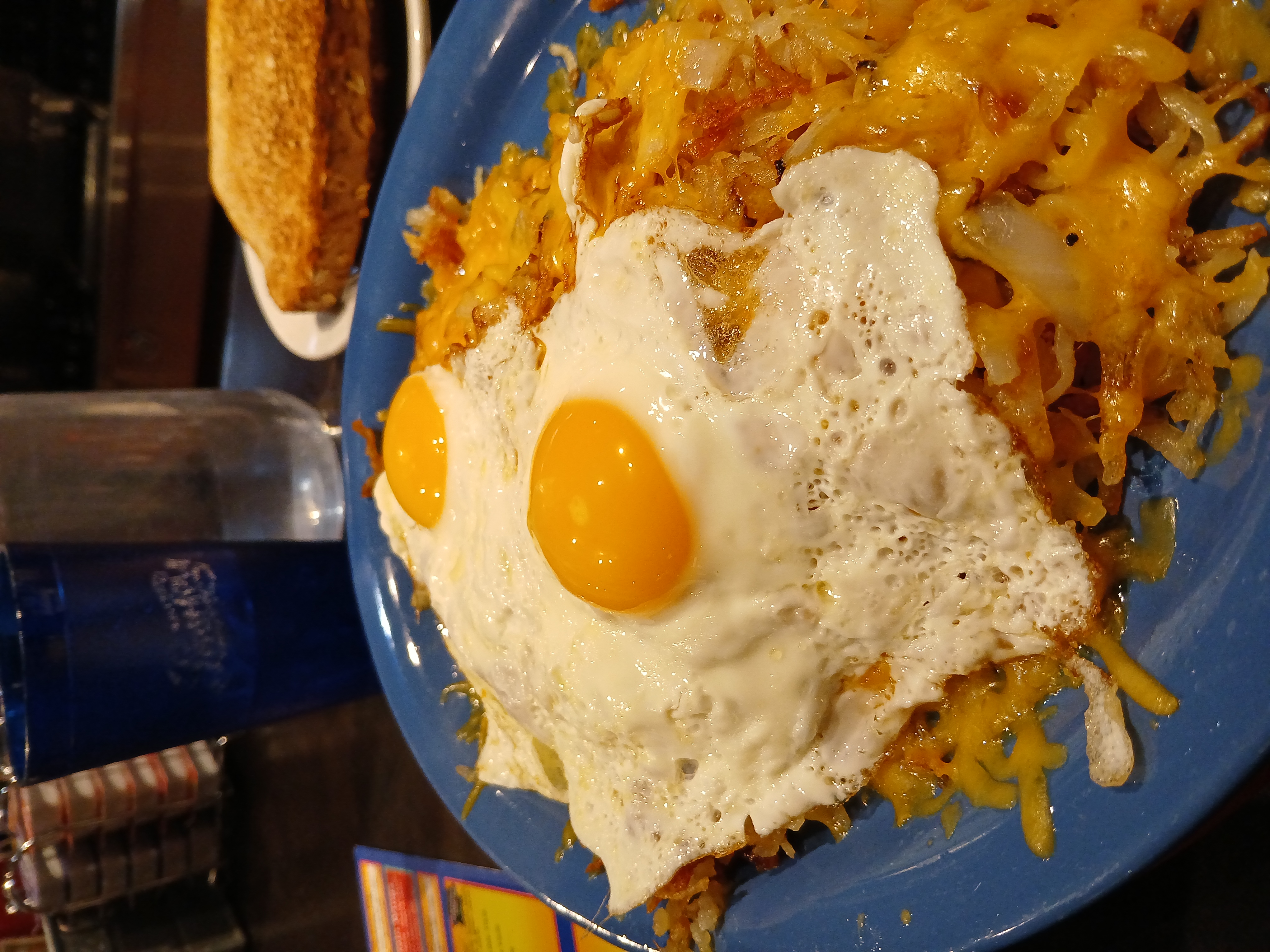 The Trailblazer: A plate of smothered hasbrowns with cheese under two fried eggs made to order, sunny-side-up, at Sam's No. 3.