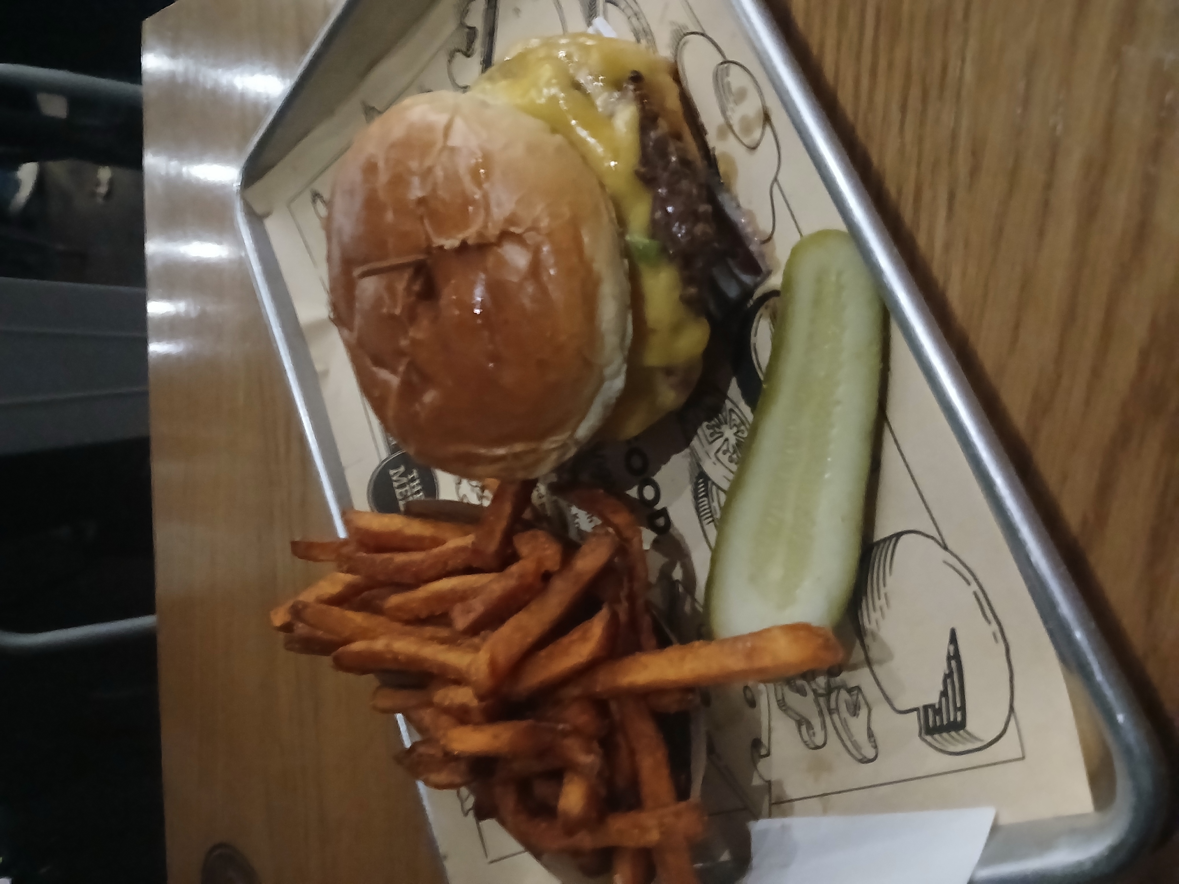 A double cheese burger and basket of sweet potato fries at The Melt