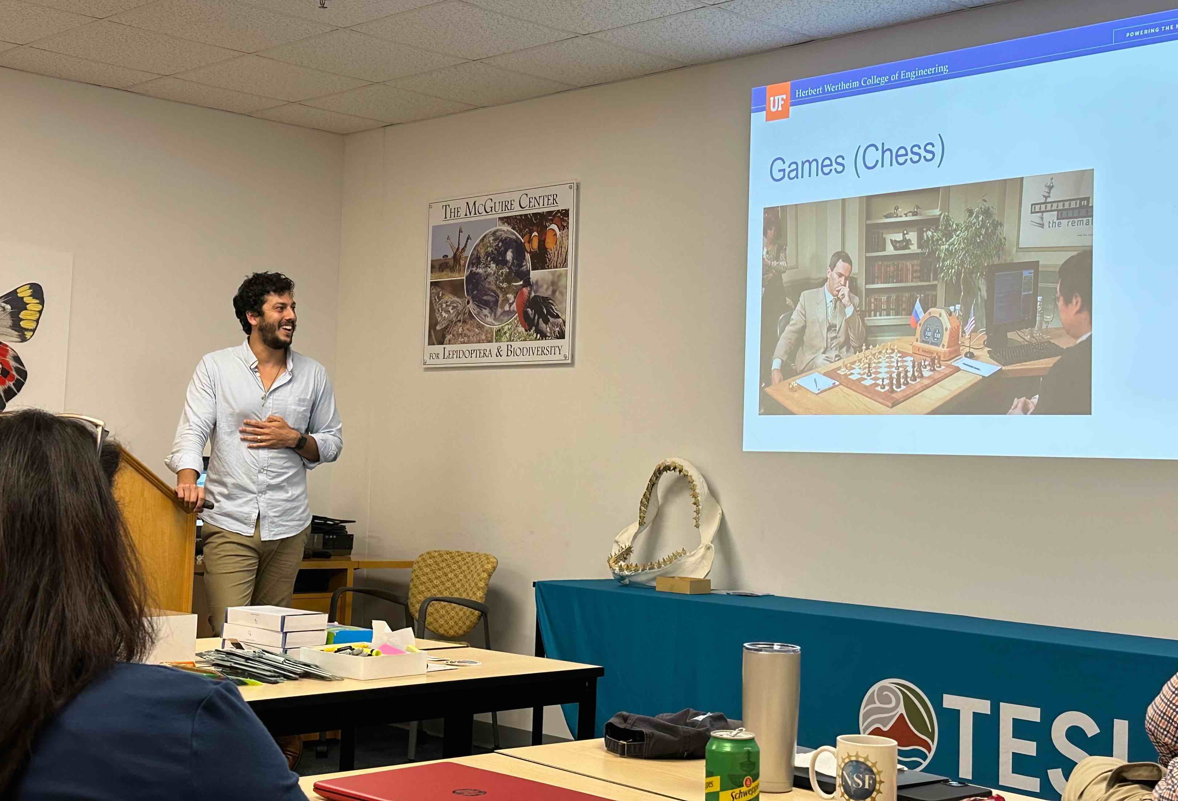 Alexander R. Webber speaking to a group of teachers about applications of AI.